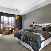 Elongated bedroom interior in gray