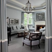 Fireplace in the living room with gray walls.