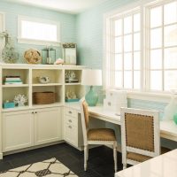 White table in front of the window in the children's room