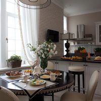 The interior of the kitchen-living room with two windows