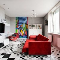 Red sofa in the living room apartment panel house