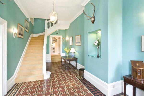 Corridor in blue tones with wallpaper for painting