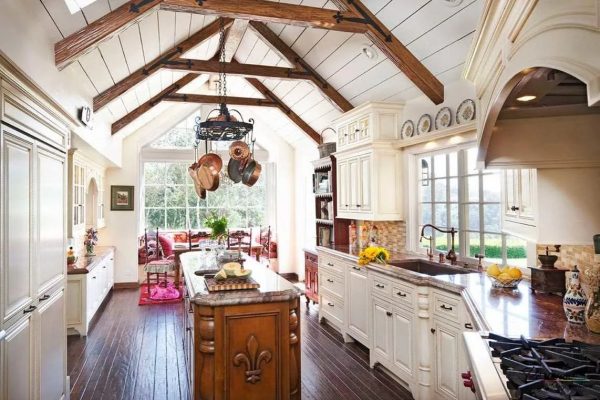 The highlight of the authentic Provence-style space is an open attic such that the roof is visible from inside the room.